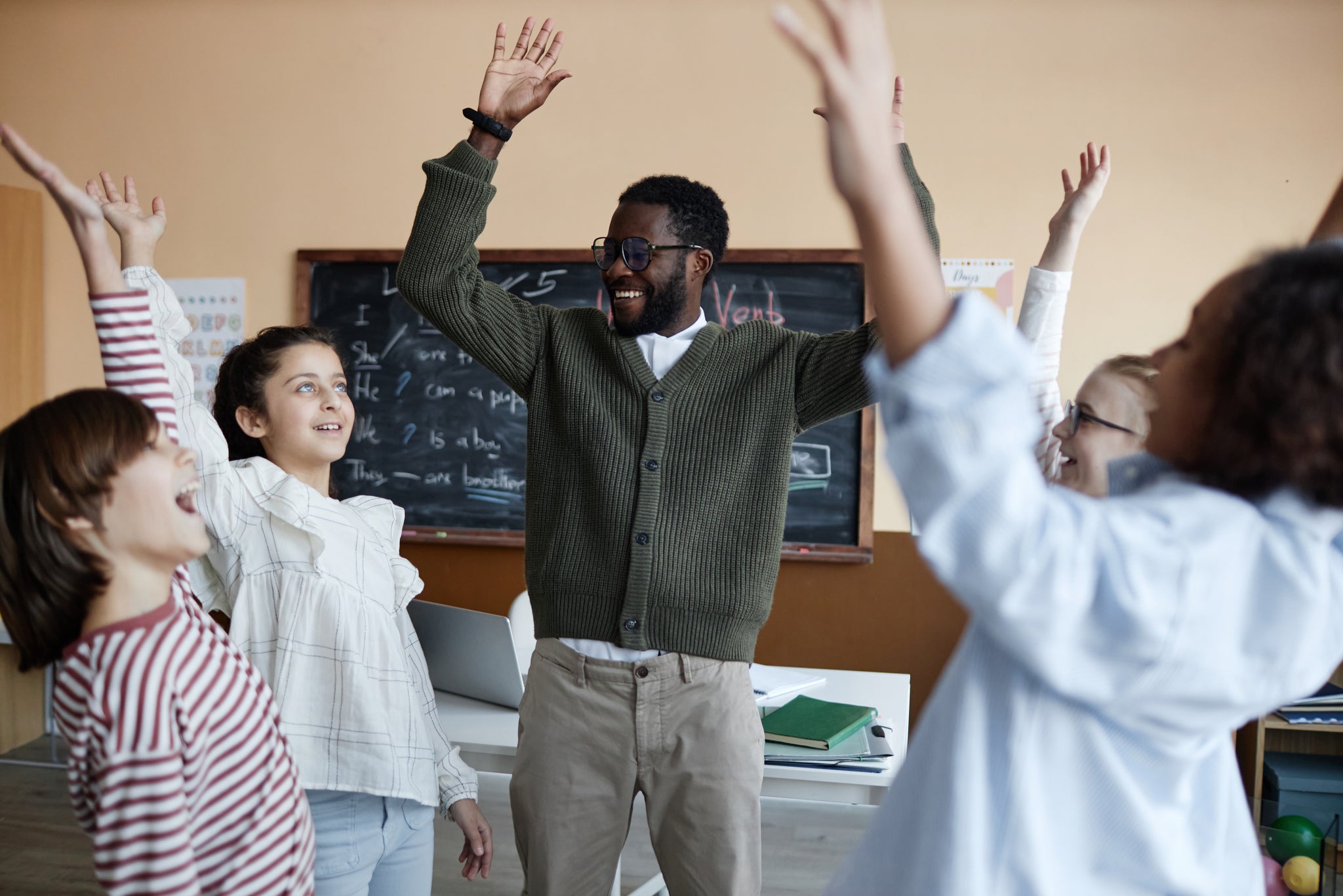 Teacher and student doing a movement break in class to Help Focus and attention. 